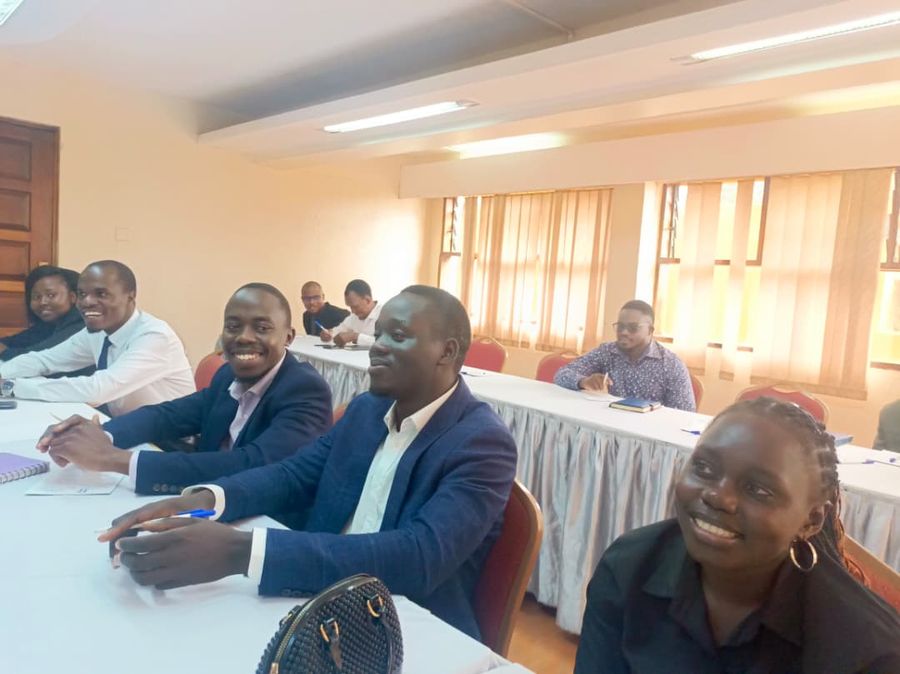 TVIA team members in discussion with community representatives
